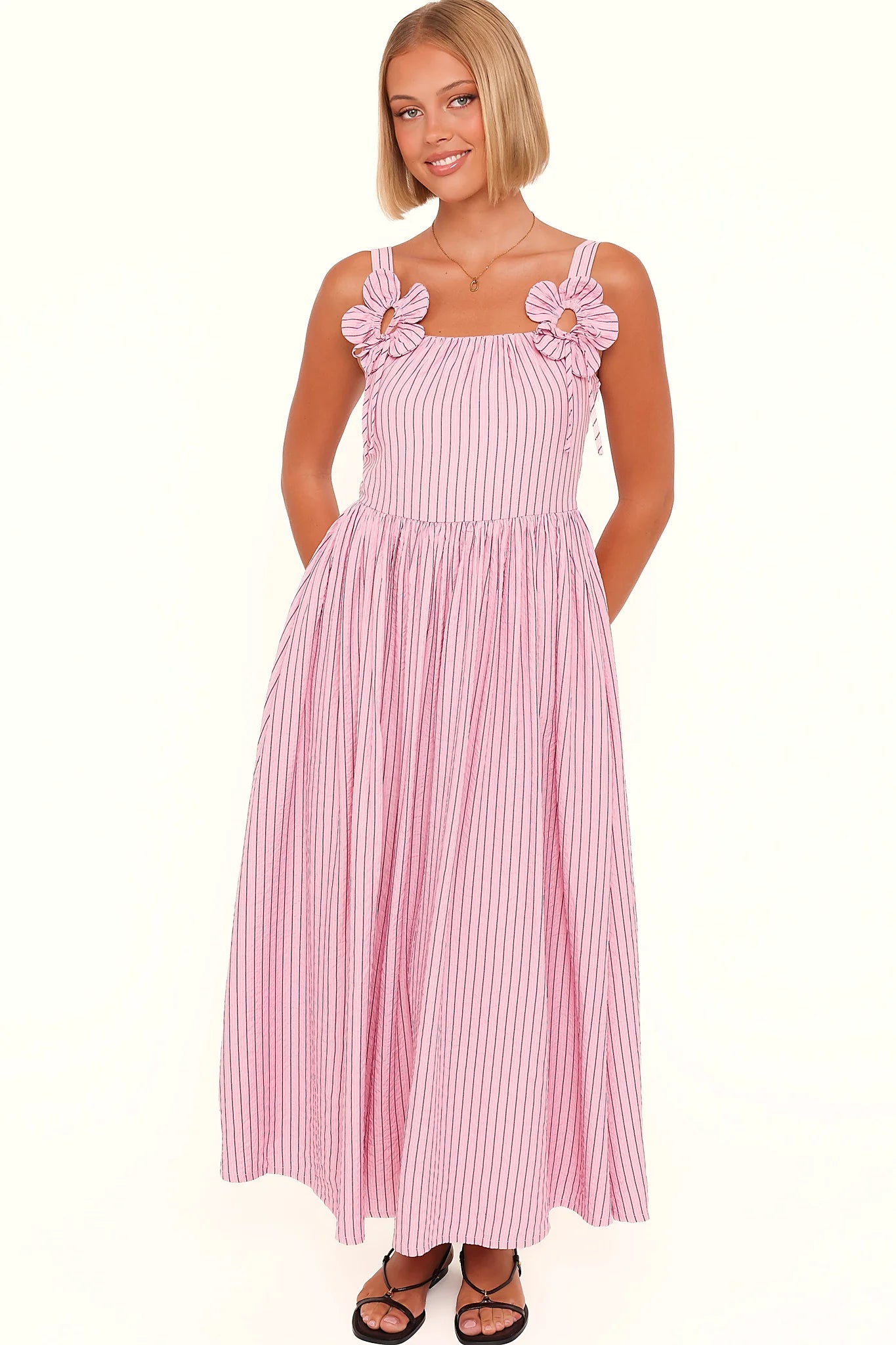Close-up of the neckline of the pink & white stripe maxi dress