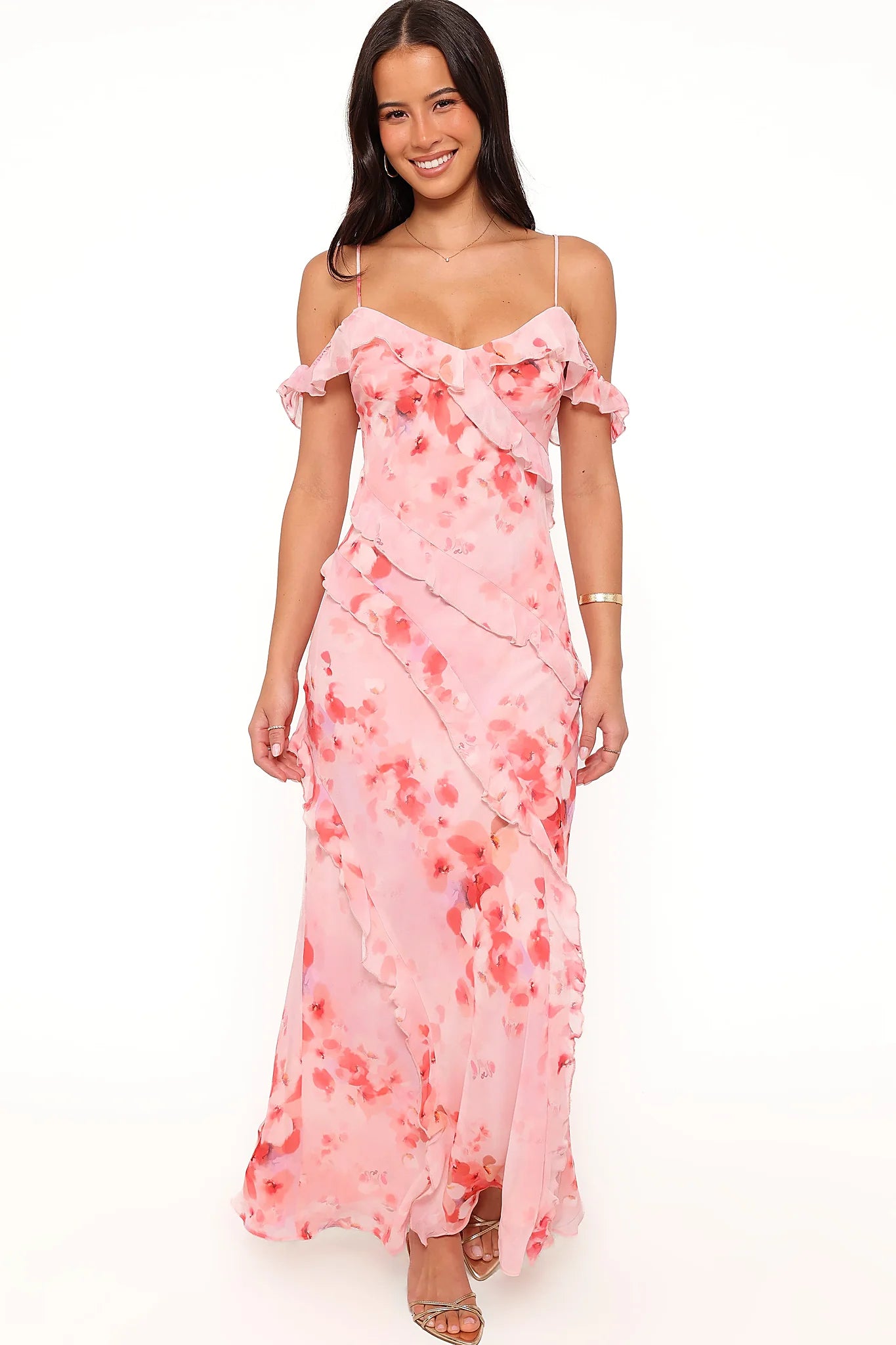 Model wearing the pink floral off-shoulder maxi dress, front view
