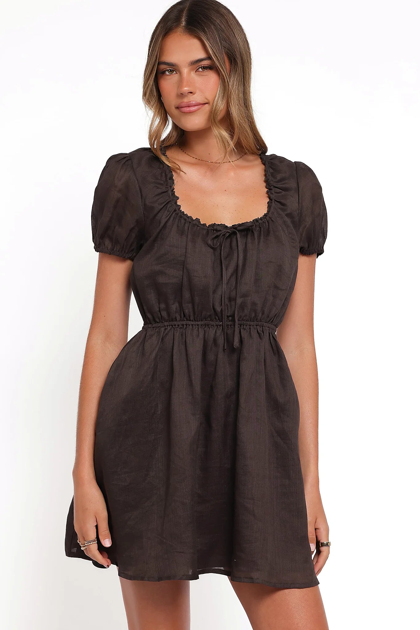 Back view of the espresso mini dress on a model