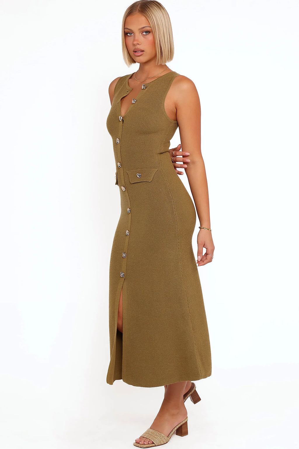 Side view showing the drape of the olive button-up knit maxi dress
