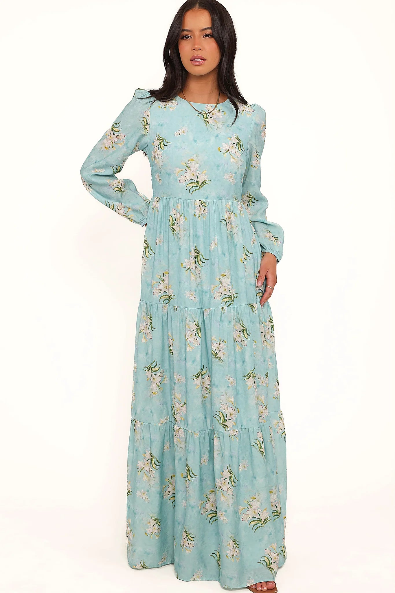 Side view showing the drape of the blue floral a-line maxi dress