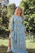 Back view of the blue floral a-line maxi dress on a model