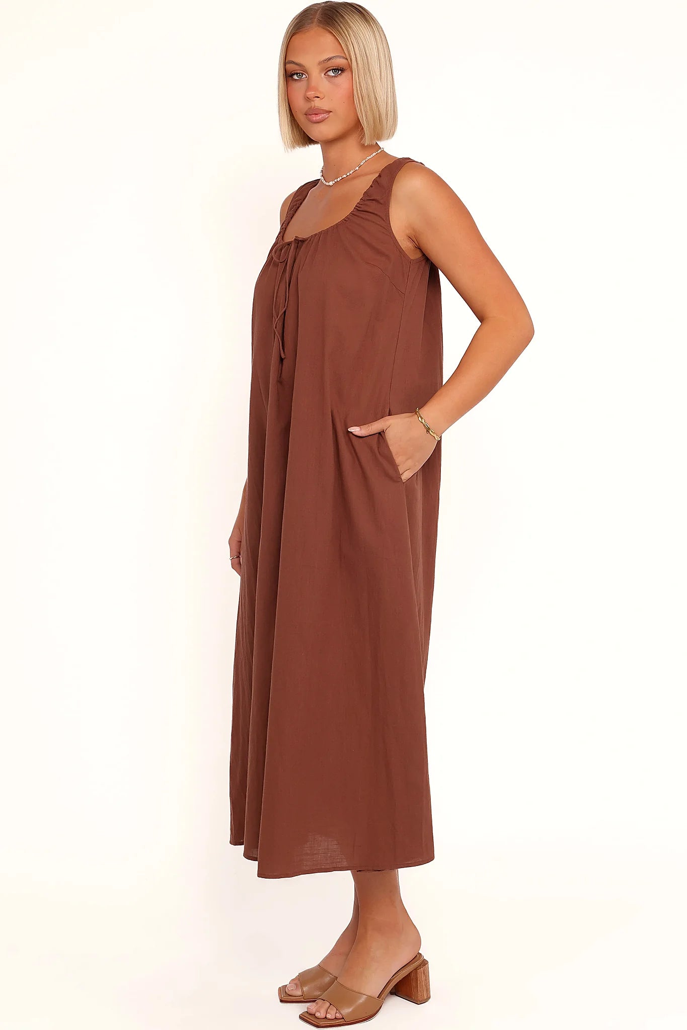 Full-length view of the chocolate brown tie-front maxi dress
