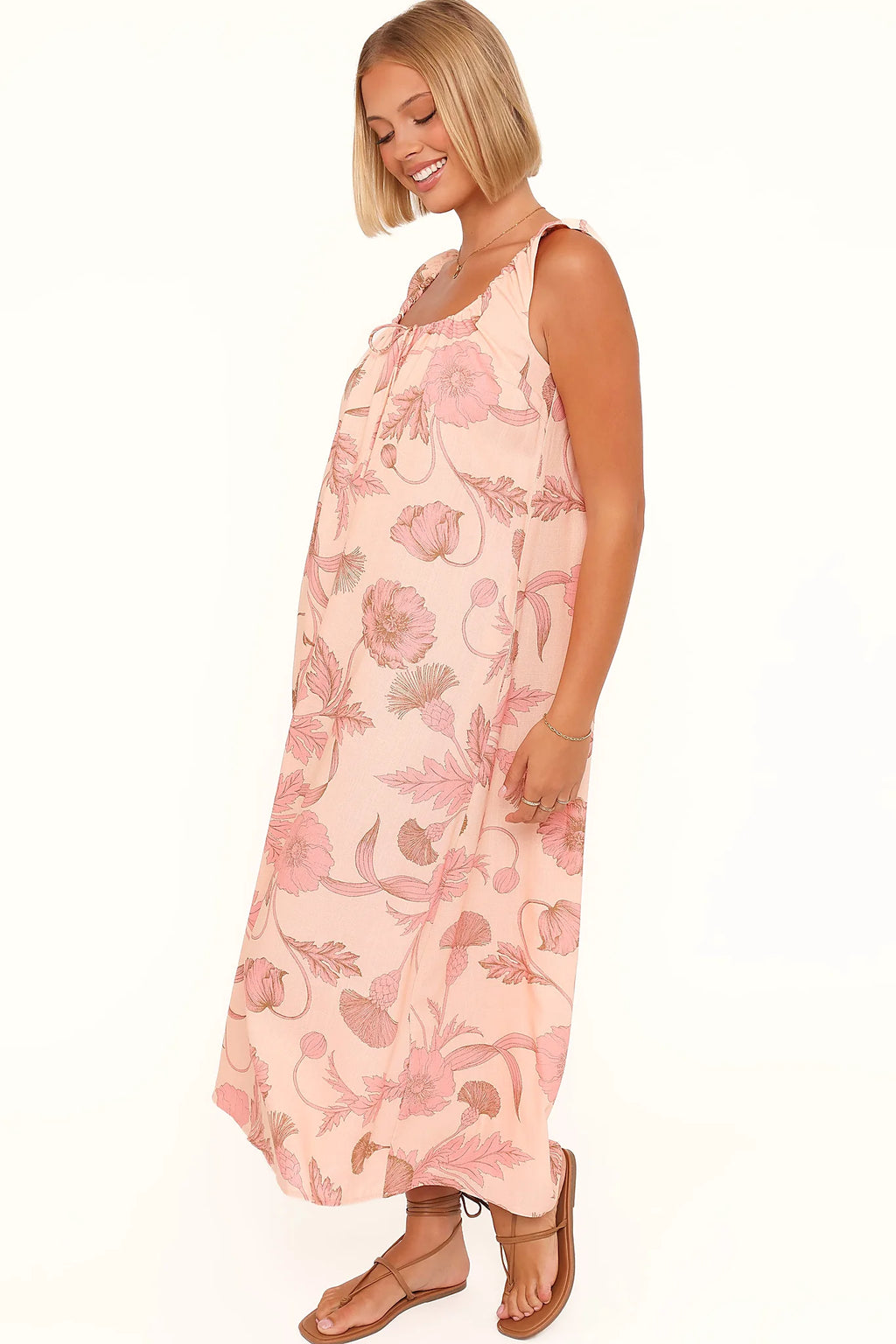 Model wearing the pink floral maxi dress, front view