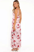 Side view showing the drape of the pink floral sleeveless maxi dress