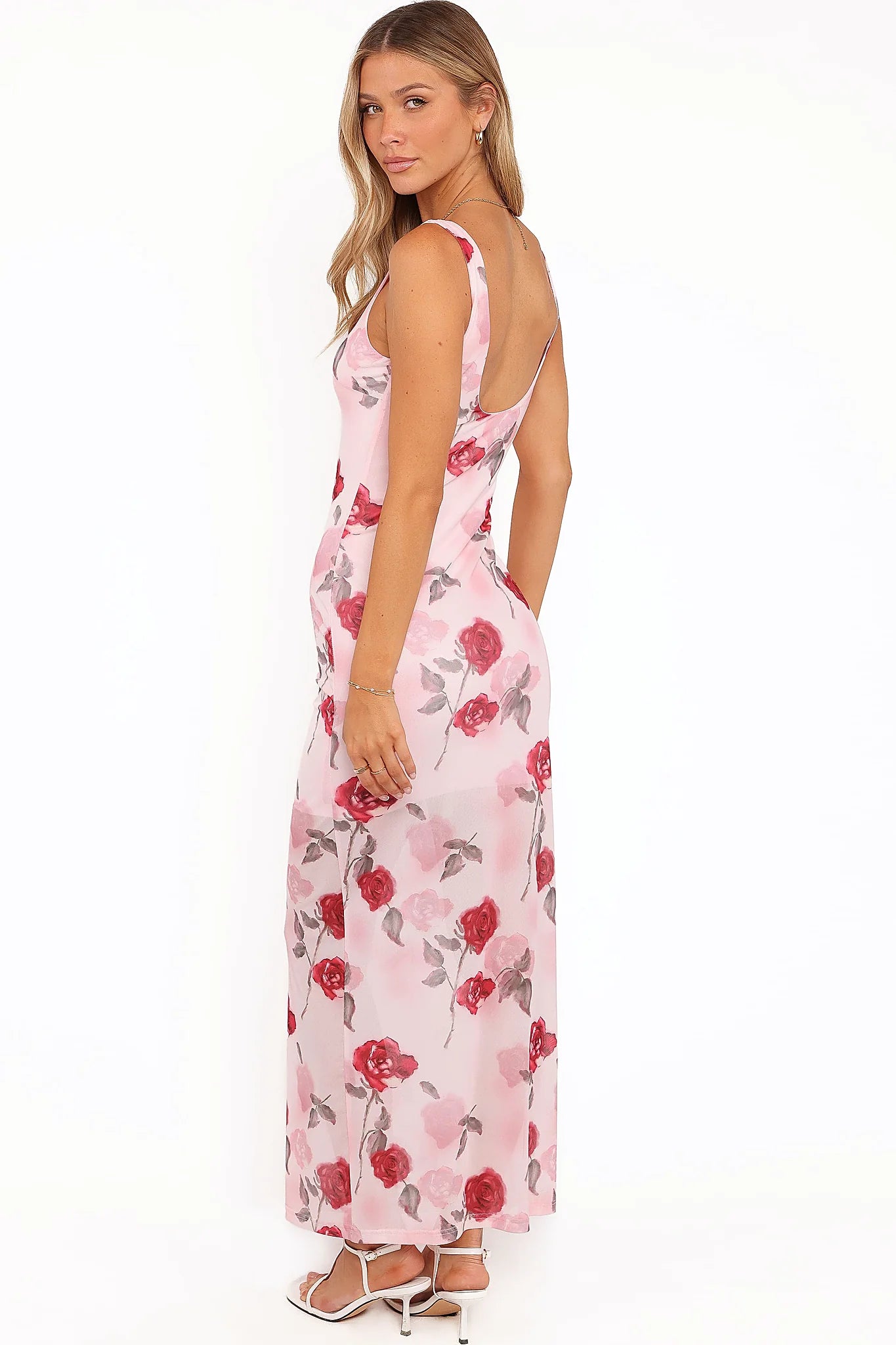 Side view showing the drape of the pink floral sleeveless maxi dress