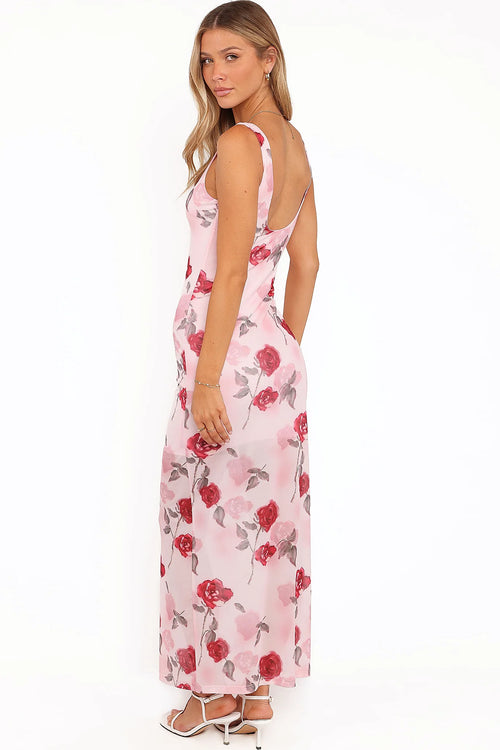 Side view showing the drape of the pink floral sleeveless maxi dress
