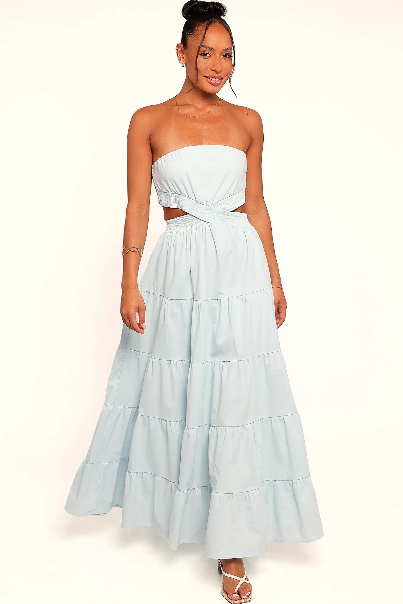 Back view of the blue strapless maxi dress on a model