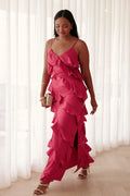 Model wearing the fuchsia ruffle satin maxi dress, front view