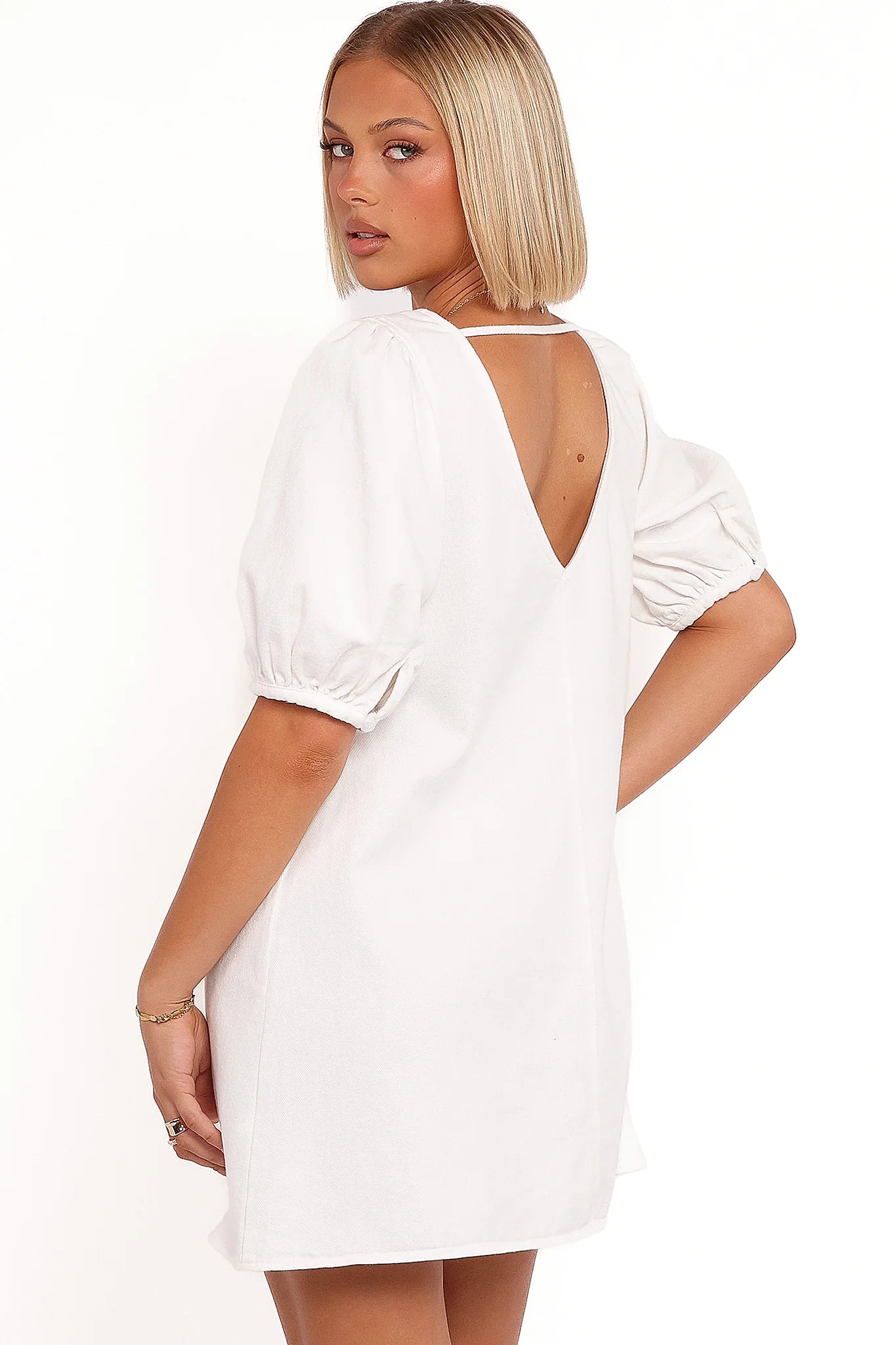 Full-length view of the cream puff-sleeve mini dress