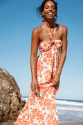 Close-up of the neckline of the red floral maxi dress