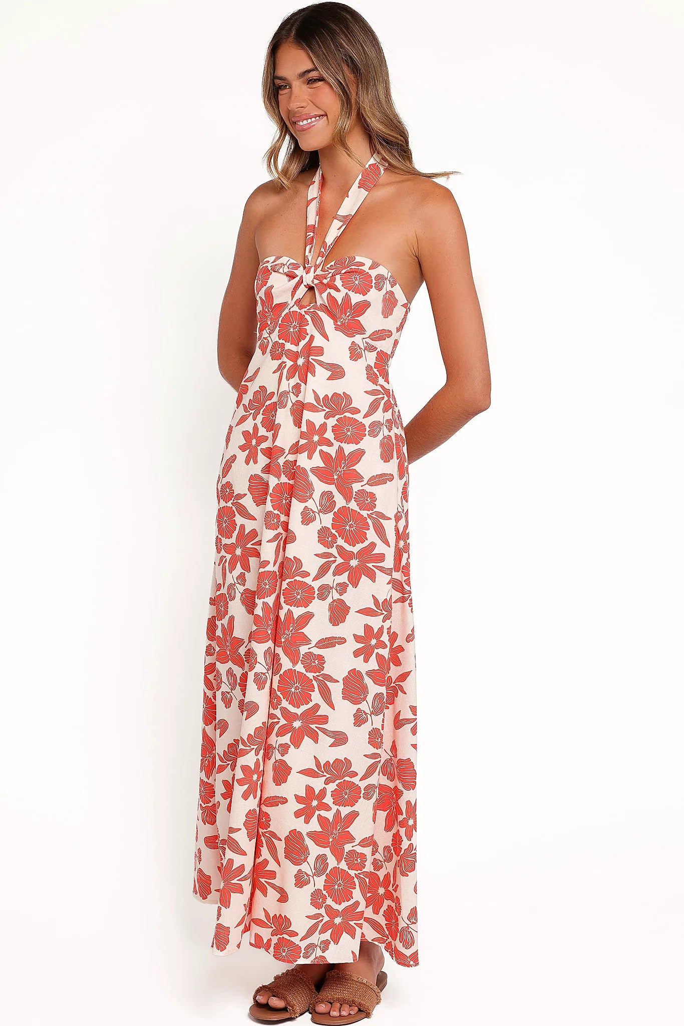 Side view showing the drape of the red floral maxi dress