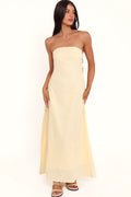 Close-up of the neckline of the butter yellow strapless maxi dress