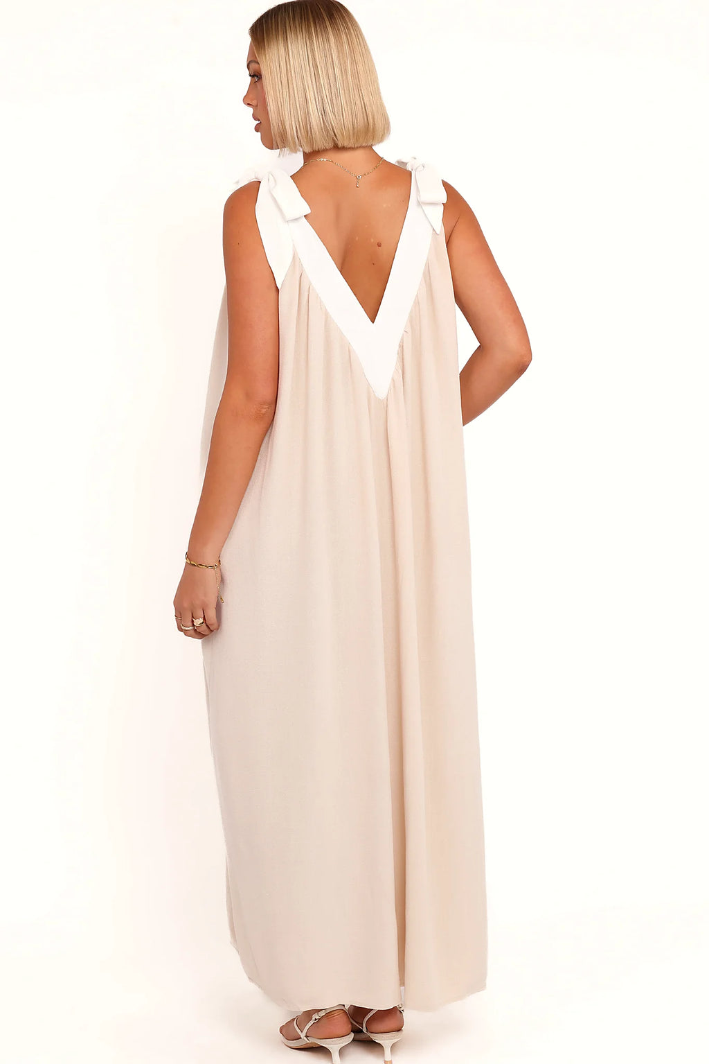 Back view of the oatmeal v-neck maxi dress on a model