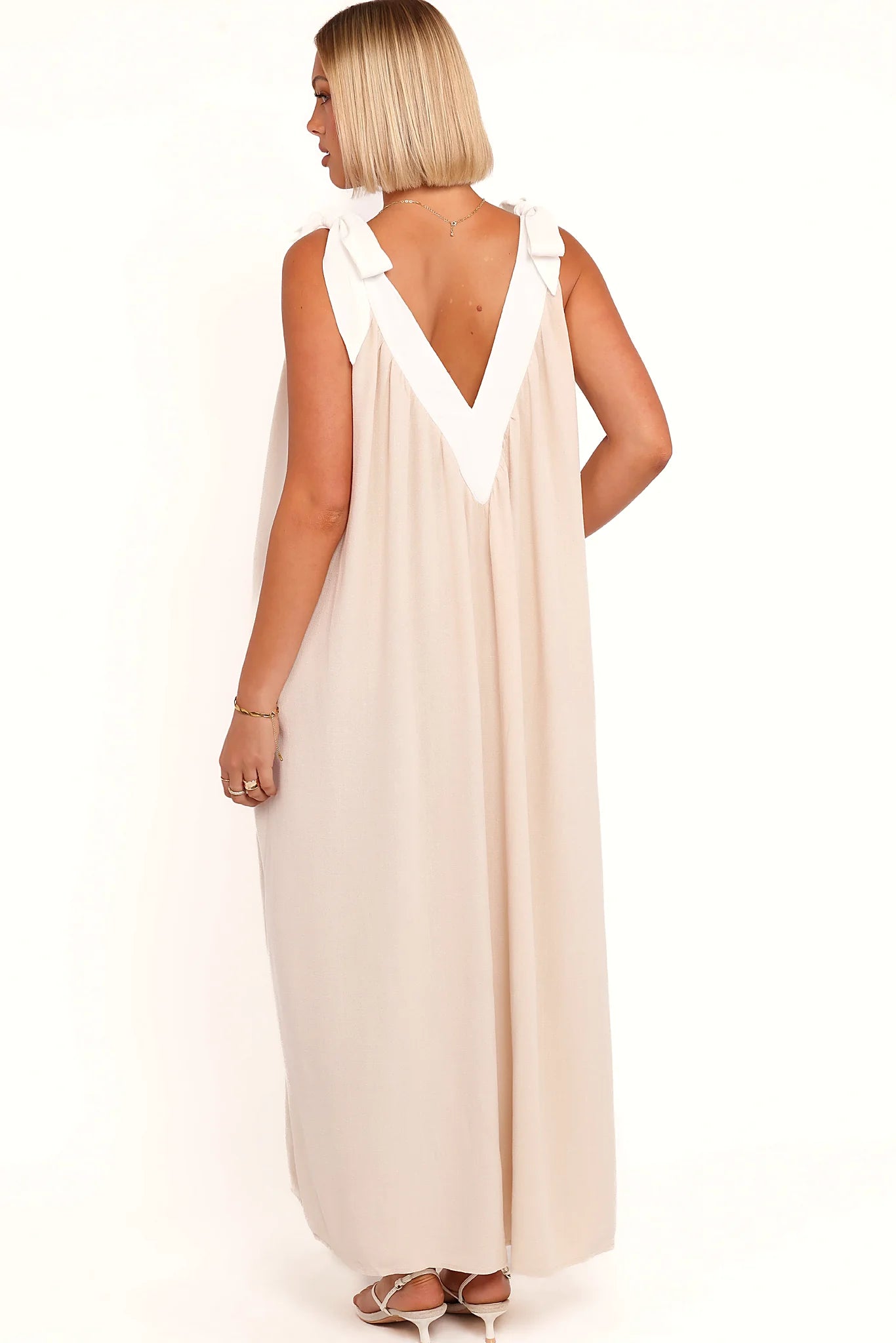 Back view of the oatmeal v-neck maxi dress on a model