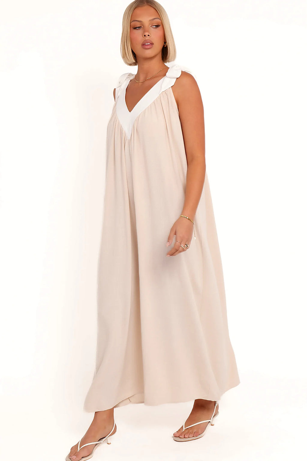 Model wearing the oatmeal v-neck maxi dress, front view
