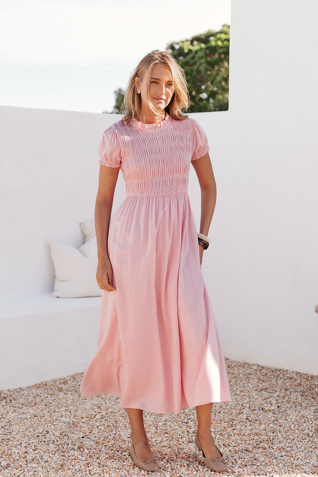 Full-length view of the pink puff-sleeve maxi dress