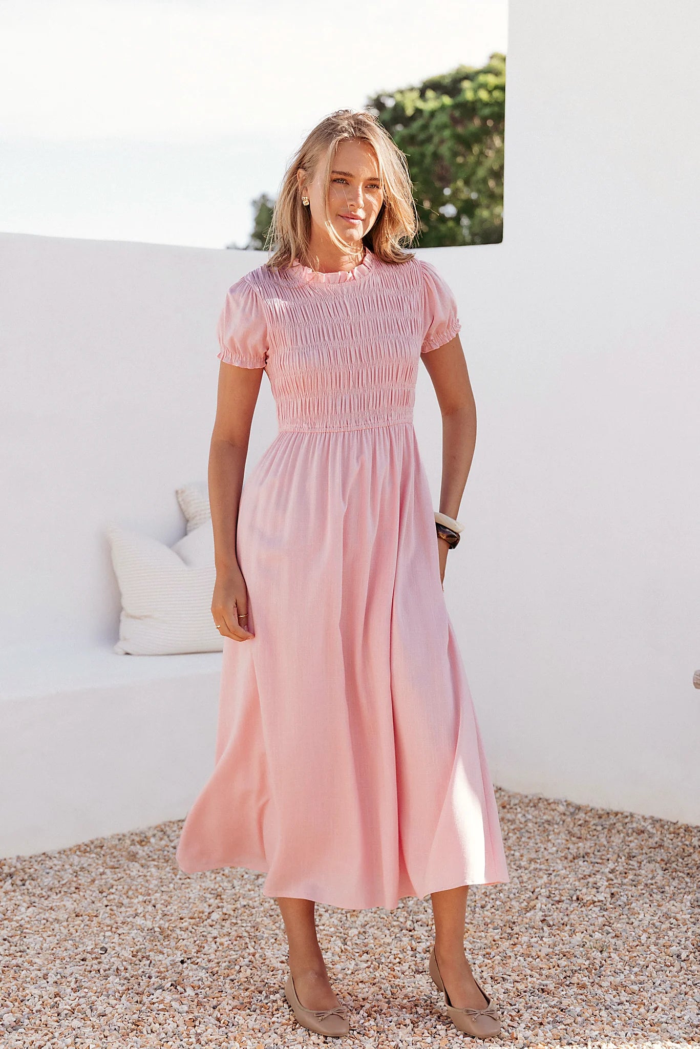 Full-length view of the pink puff-sleeve maxi dress