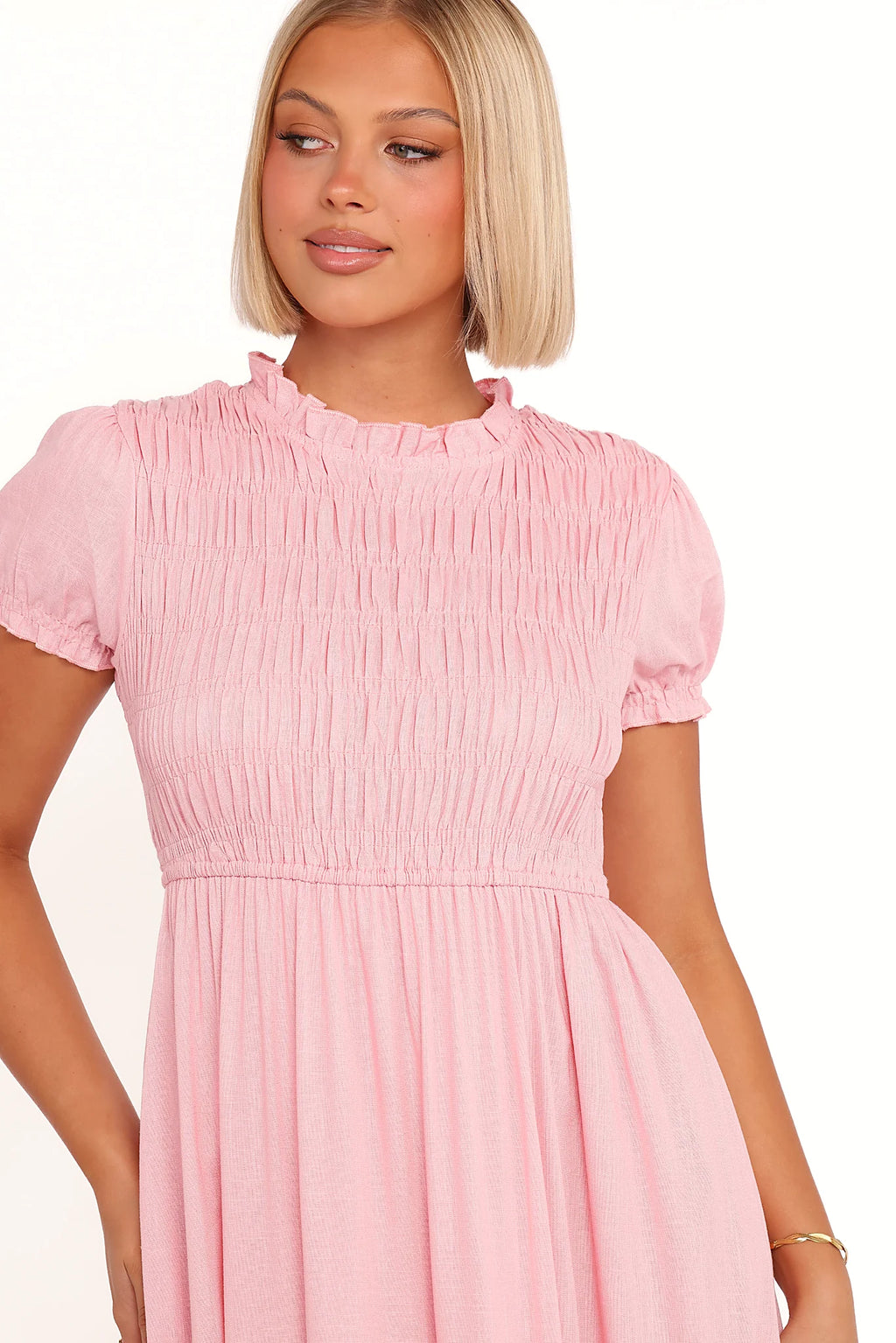 Close-up of the neckline of the pink puff-sleeve maxi dress