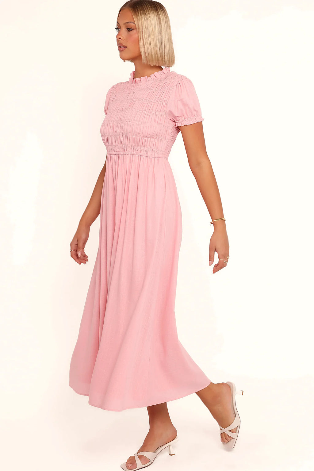 Model wearing the pink puff-sleeve maxi dress, front view