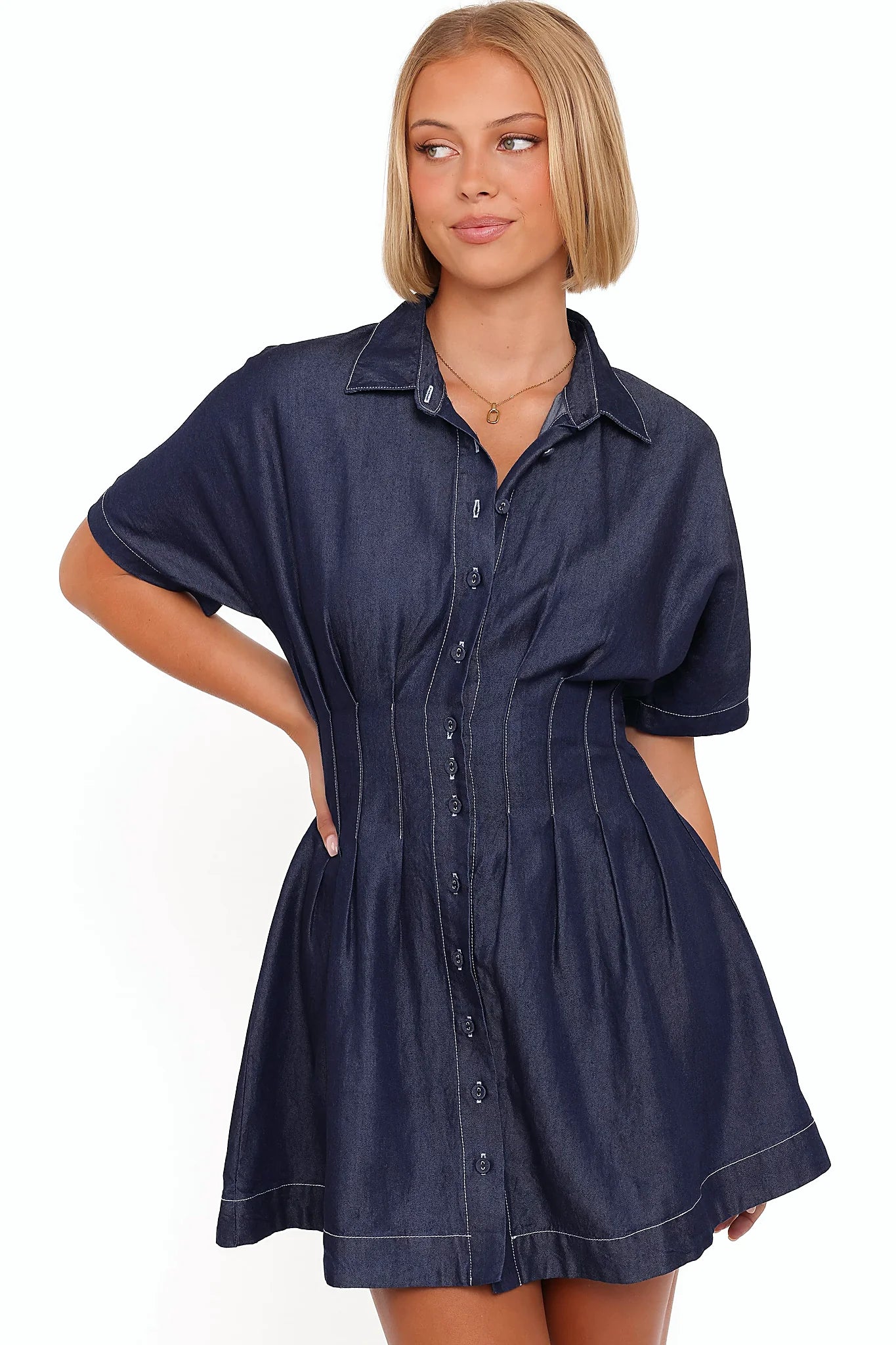 Close-up of the neckline of the blue mini dress