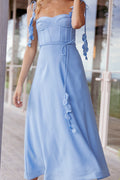 Side view showing the drape of the pale blue sweetheart midi dress