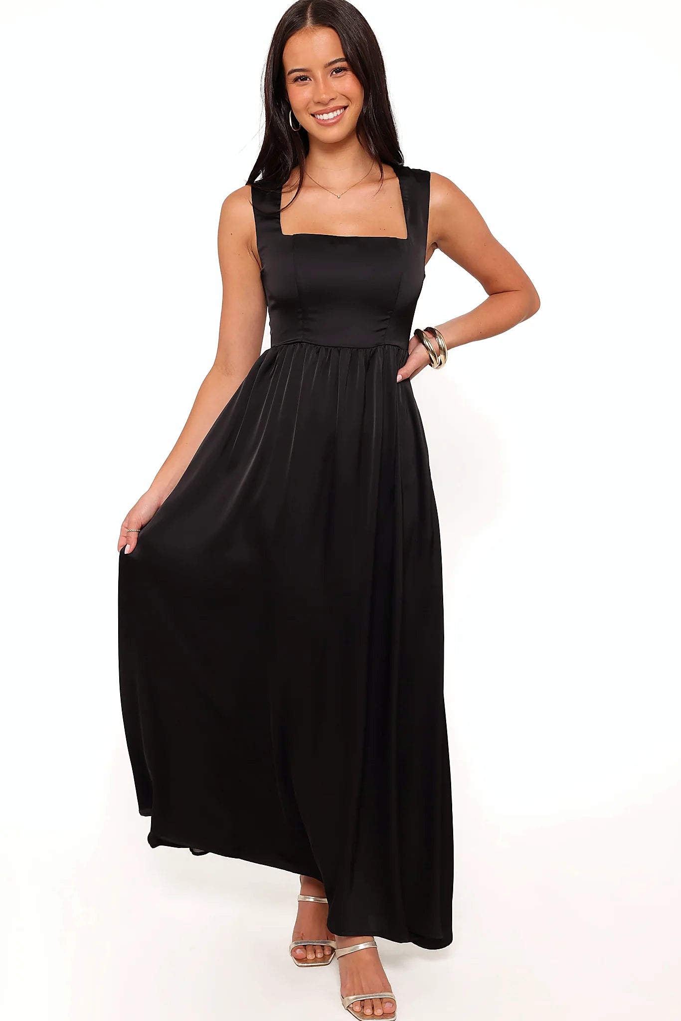 Detail view of the black satin-feel maxi dress