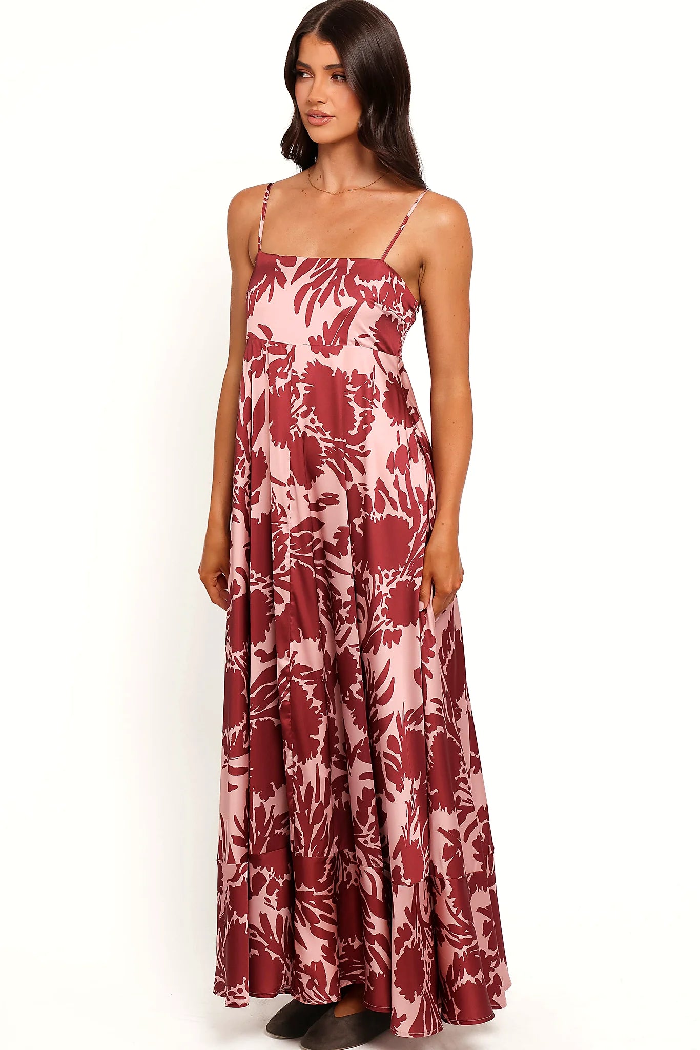 Back view of the pale burgundy floral maxi dress on a model