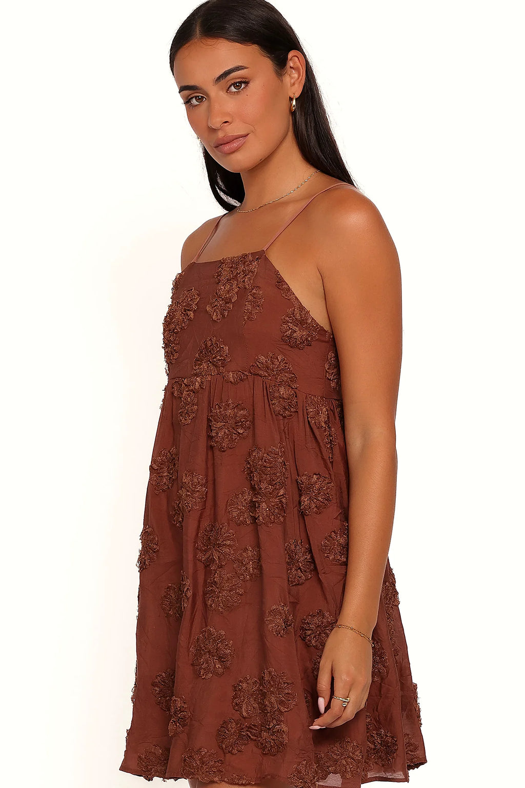 Close-up of the neckline of the brown textured floral mini dress
