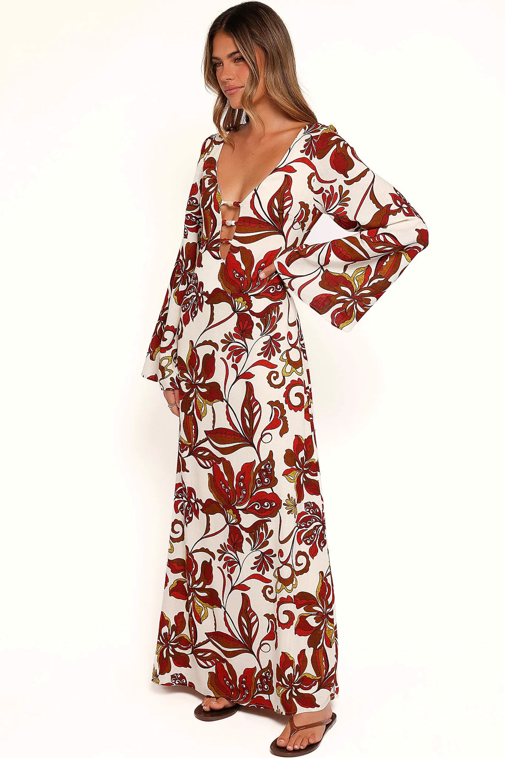 Close-up of the neckline of the brown floral bead-detail maxi dress