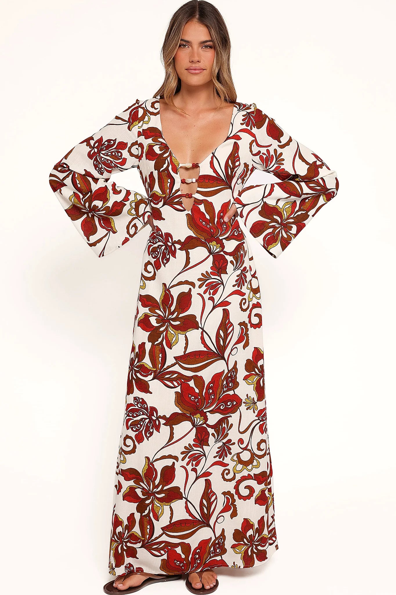 Full-length view of the brown floral bead-detail maxi dress