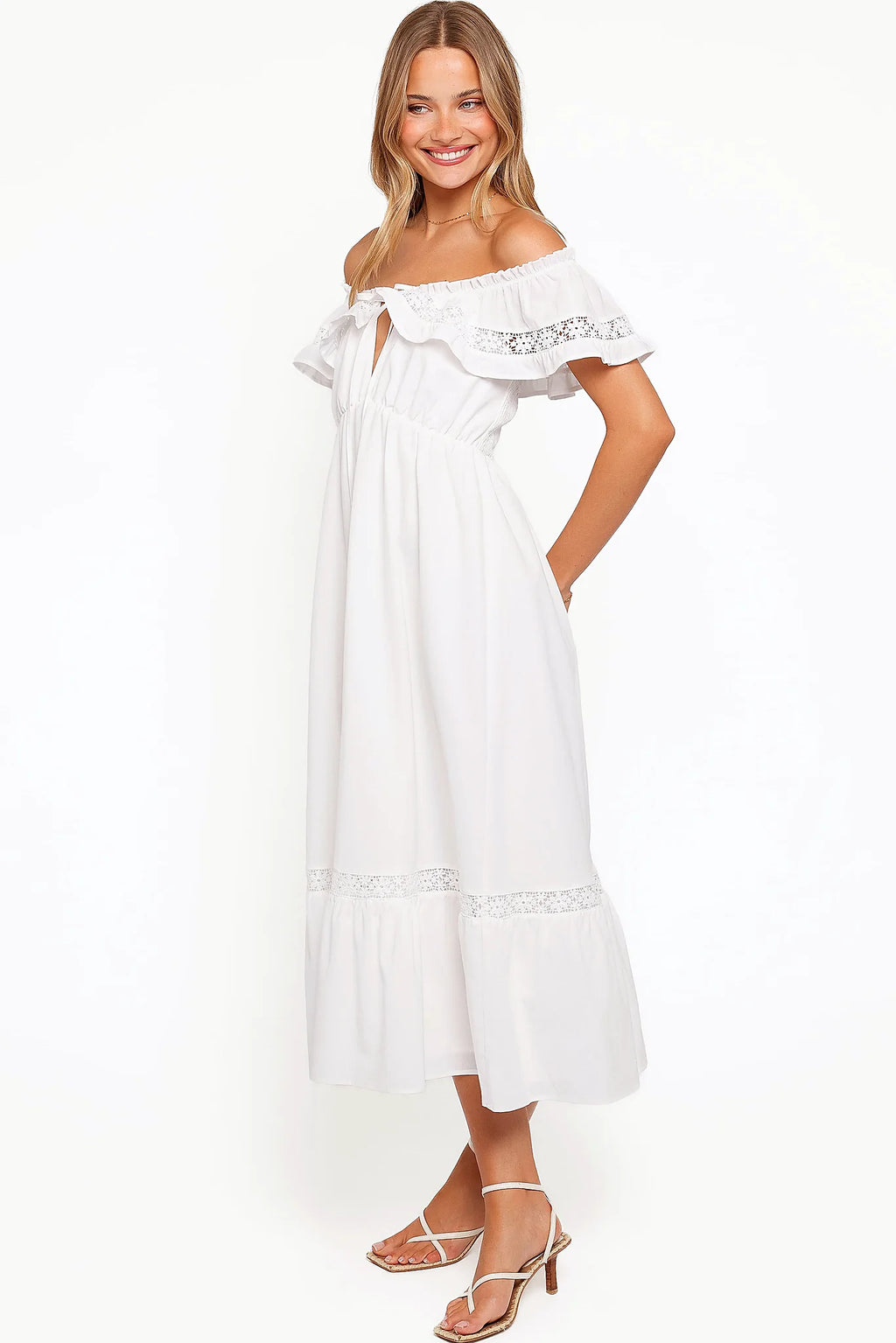 Back view of the white floral lace maxi dress on a model