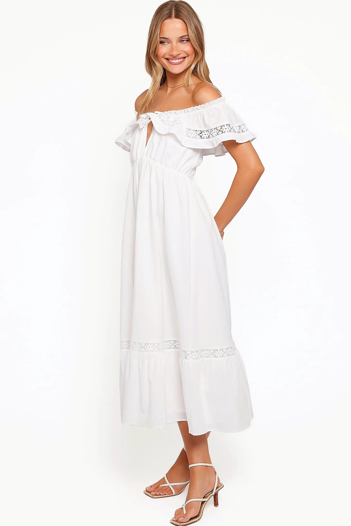 Back view of the white floral lace maxi dress on a model