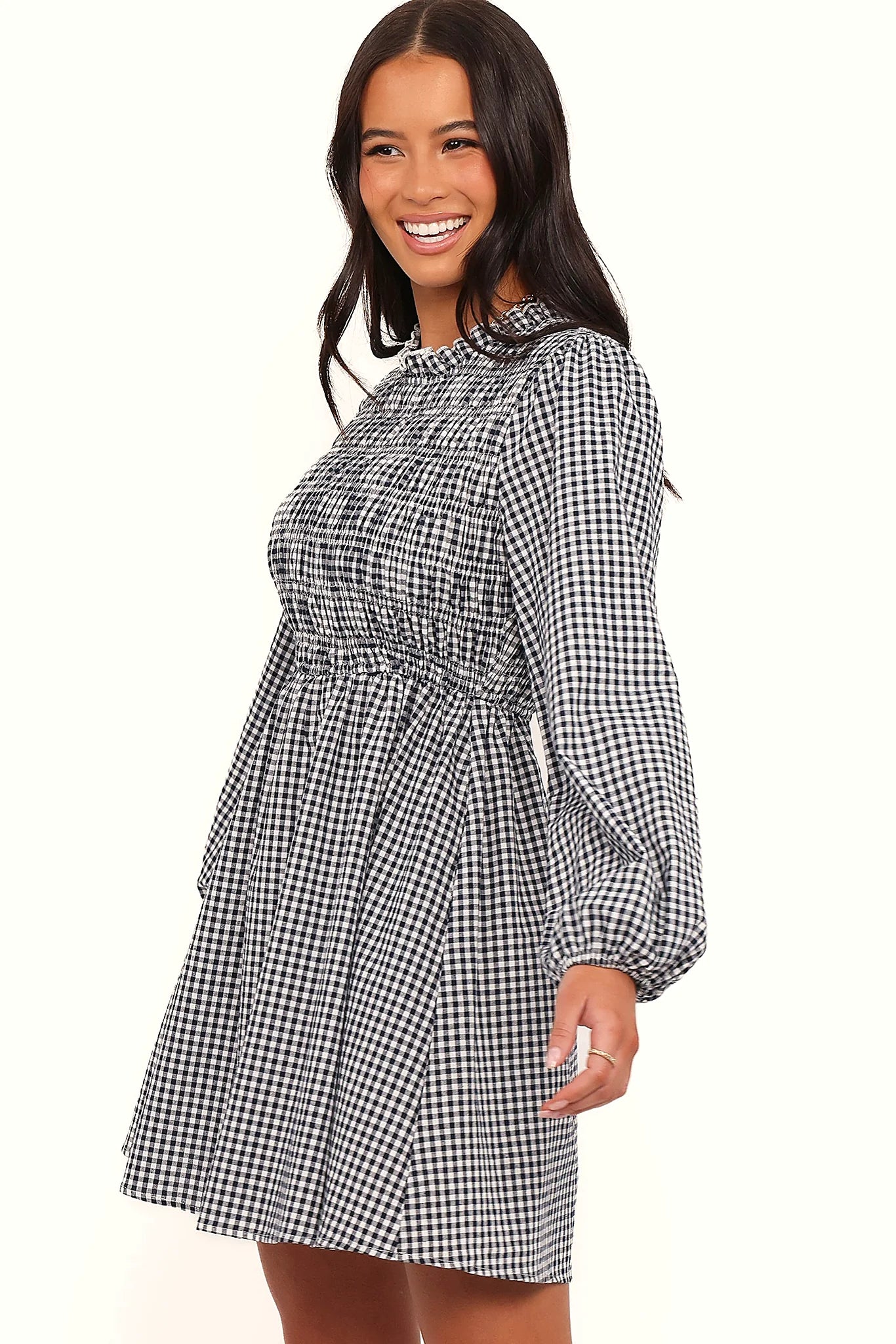 Full-length view of the navy gingham long sleeve mini dress