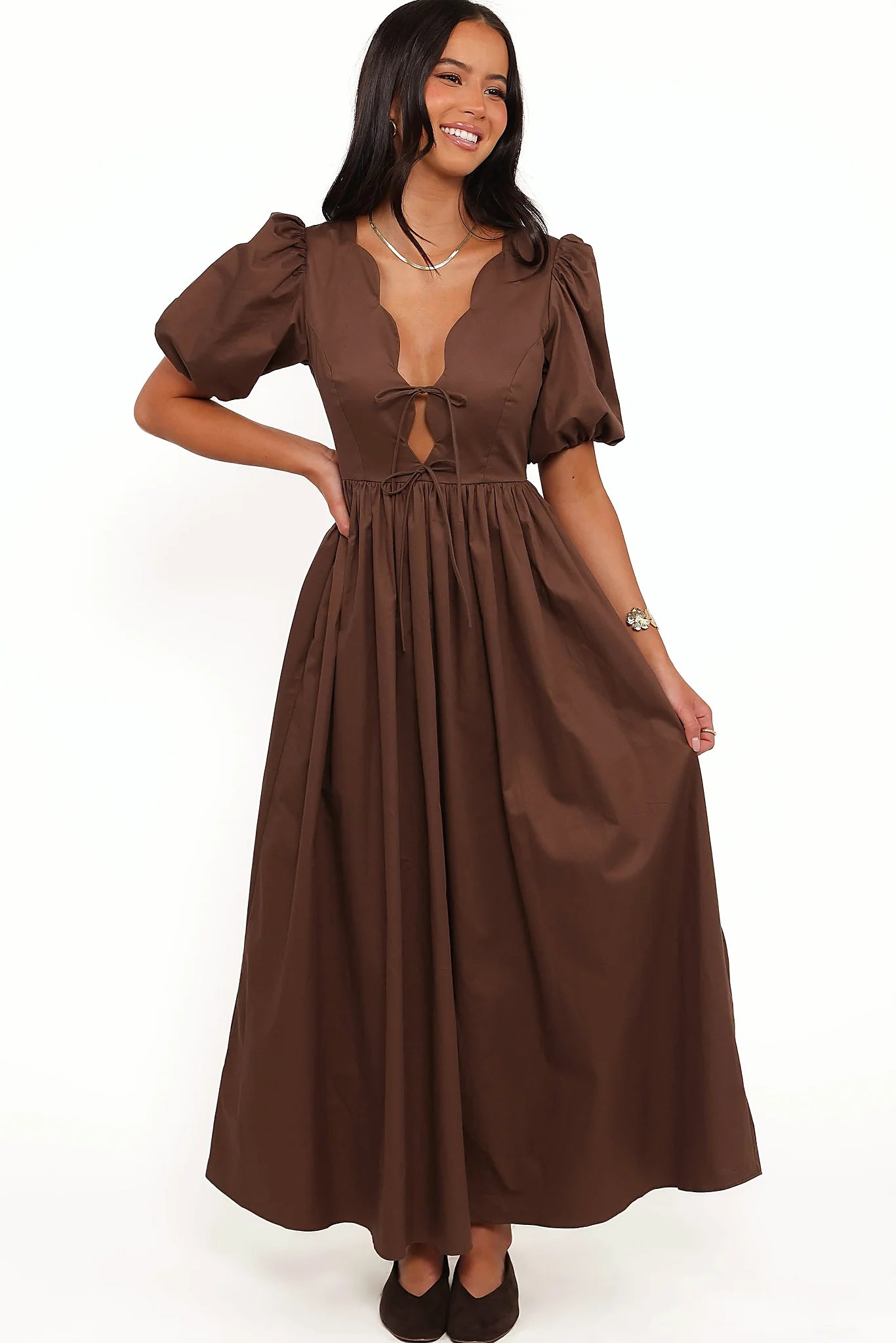 Back view of the bitter chocolate empire maxi dress on a model