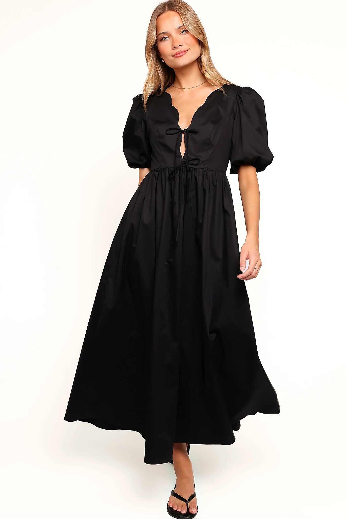 Detail view of the black empire waist maxi dress