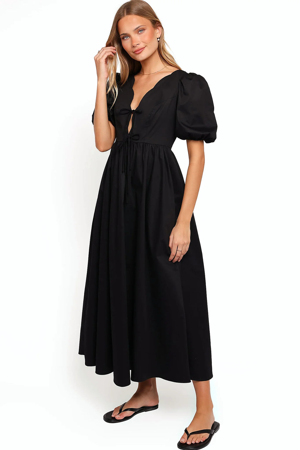 Model wearing the black empire waist maxi dress, front view