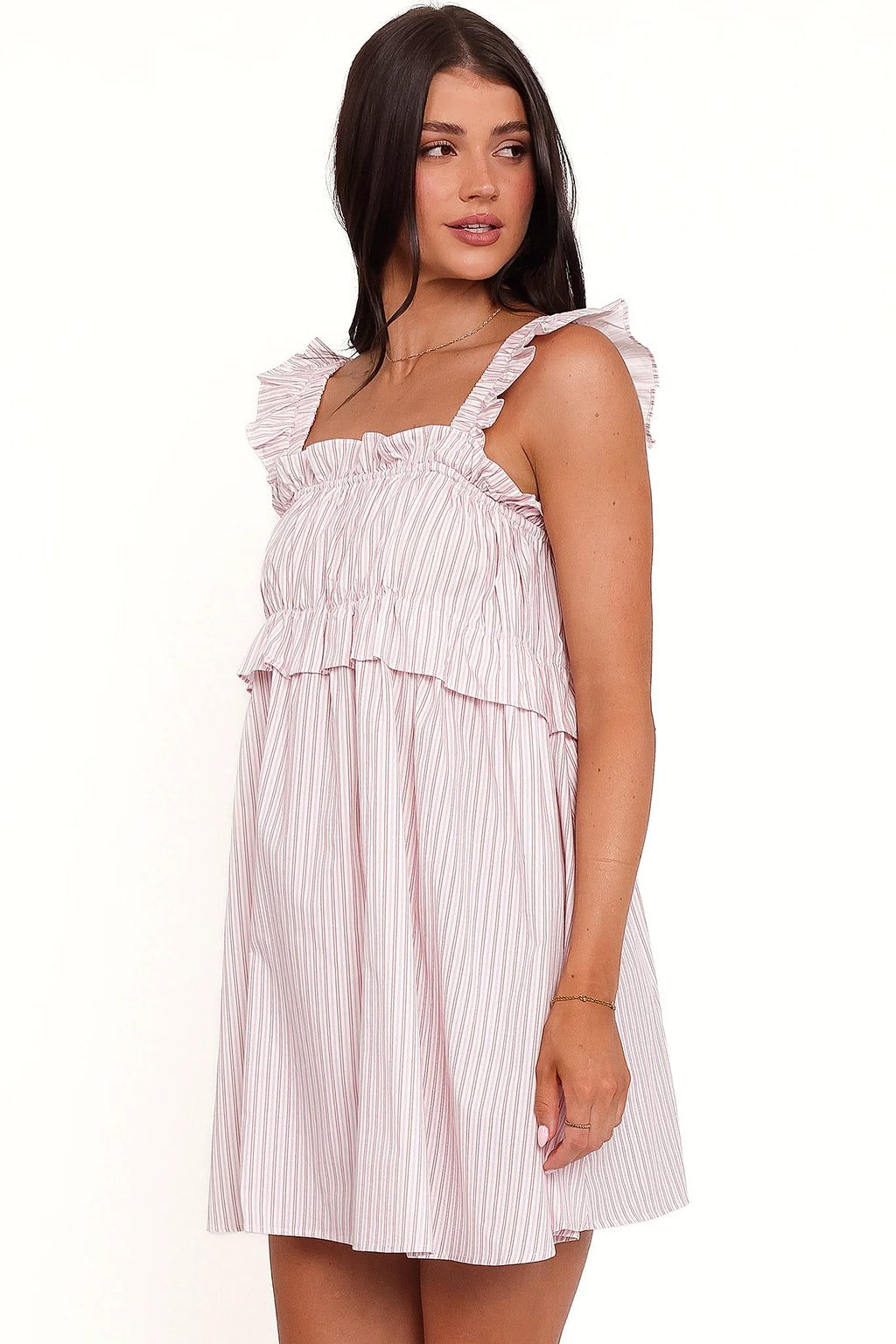Model wearing the pink stripe mini dress, front view