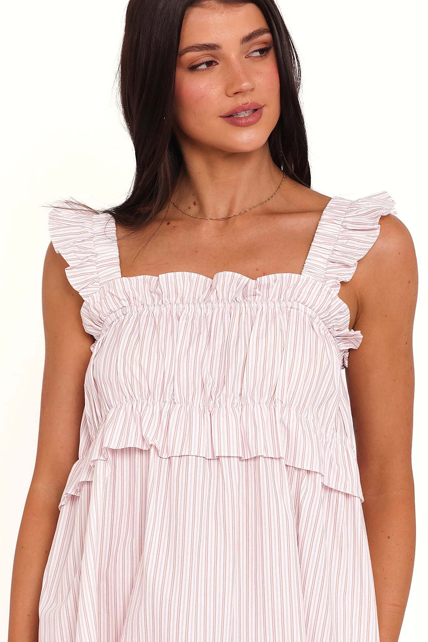 Close-up of the neckline of the pink stripe mini dress