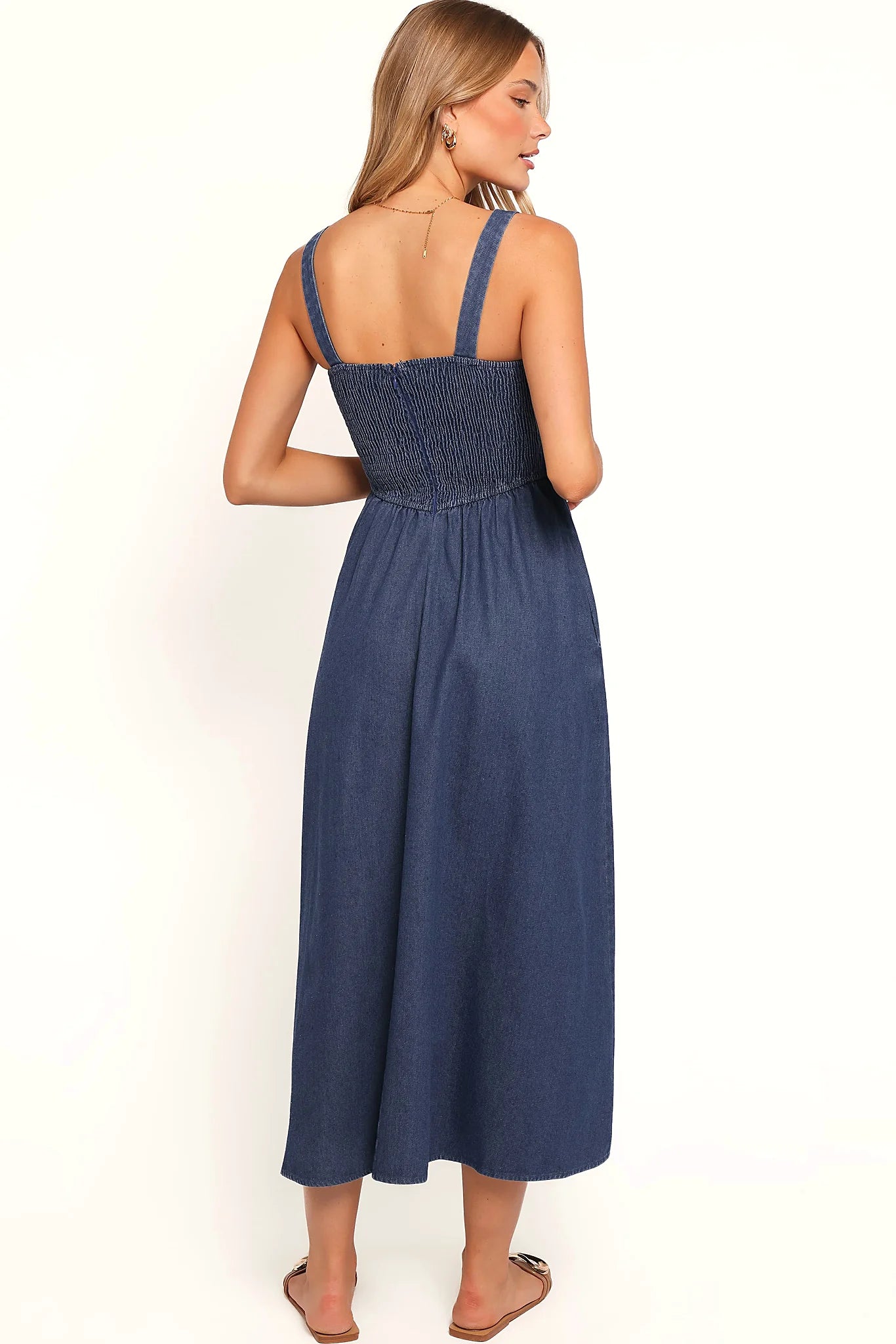 Close-up of the neckline of the denim square-neck midi dress