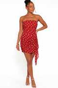 Detail view of the red polka dot strapless mini dress
