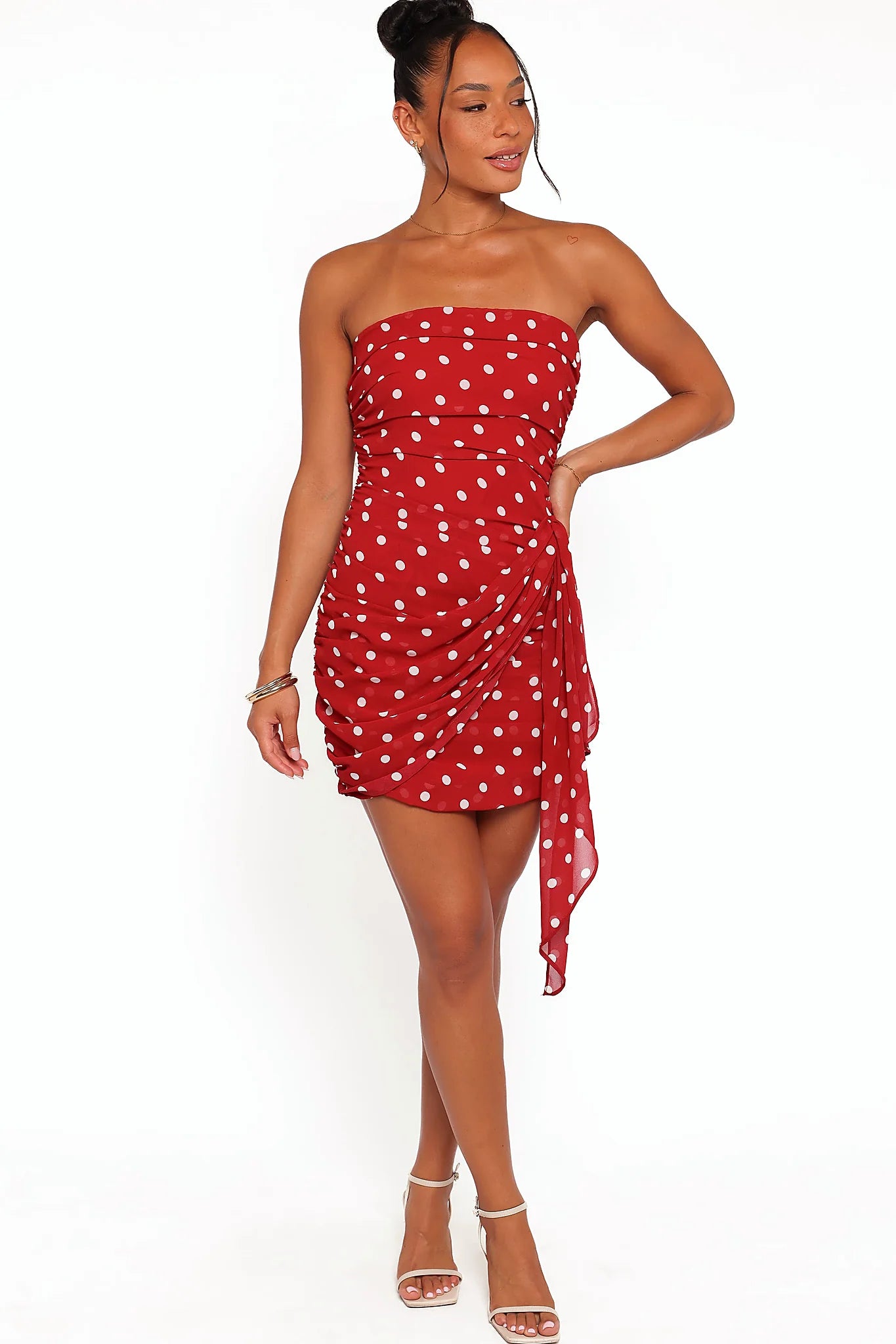 Detail view of the red polka dot strapless mini dress