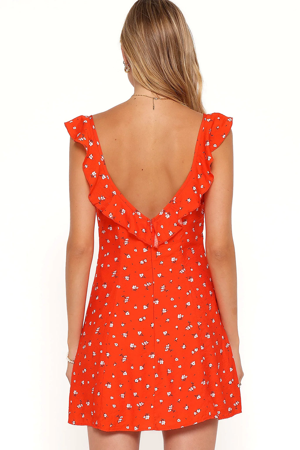 Model wearing the red floral mini dress, front view