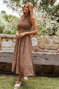 Back view of the brown floral frill-neck maxi dress on a model