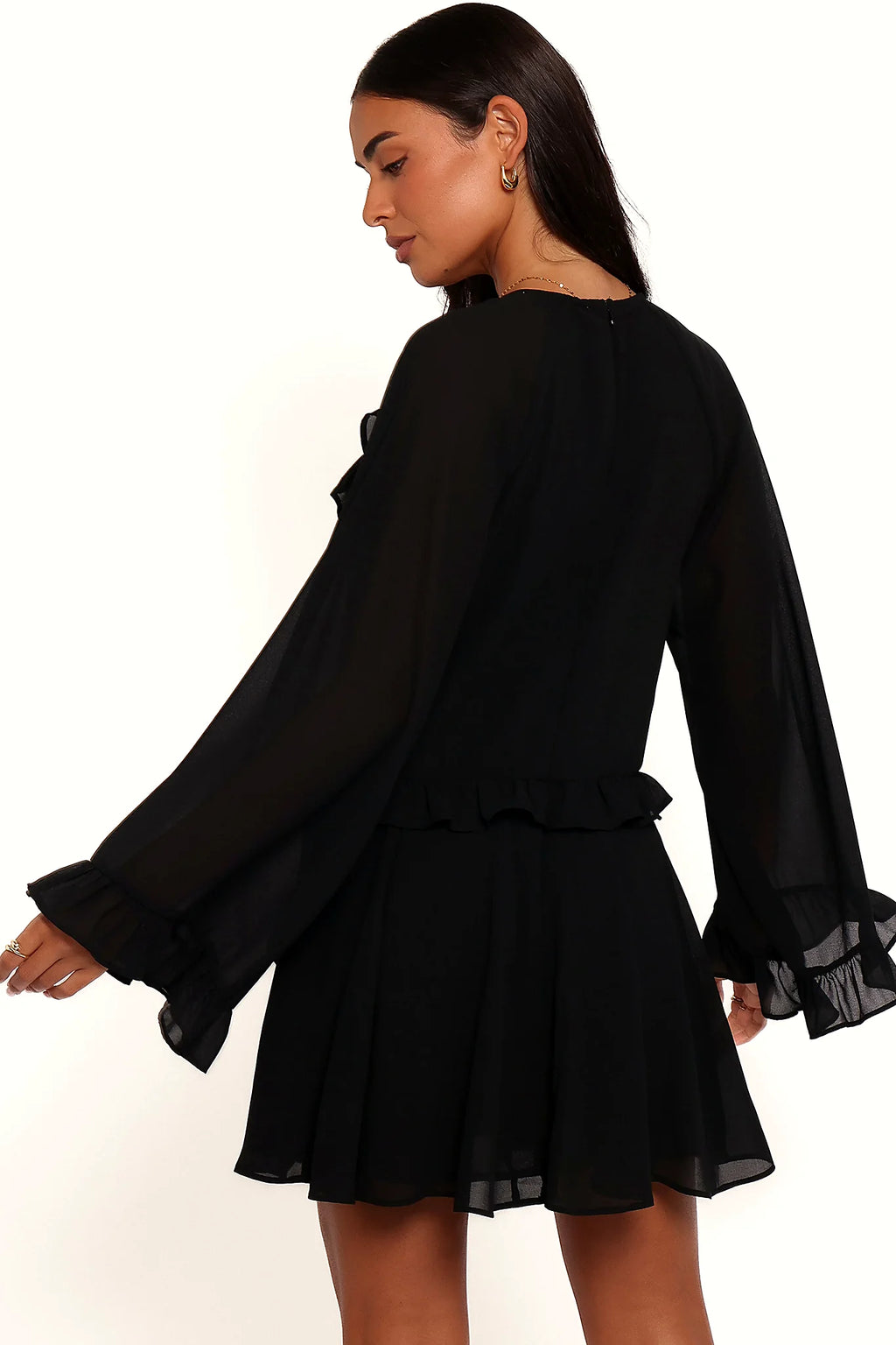 Close-up of the neckline of the black flare-sleeve mini dress