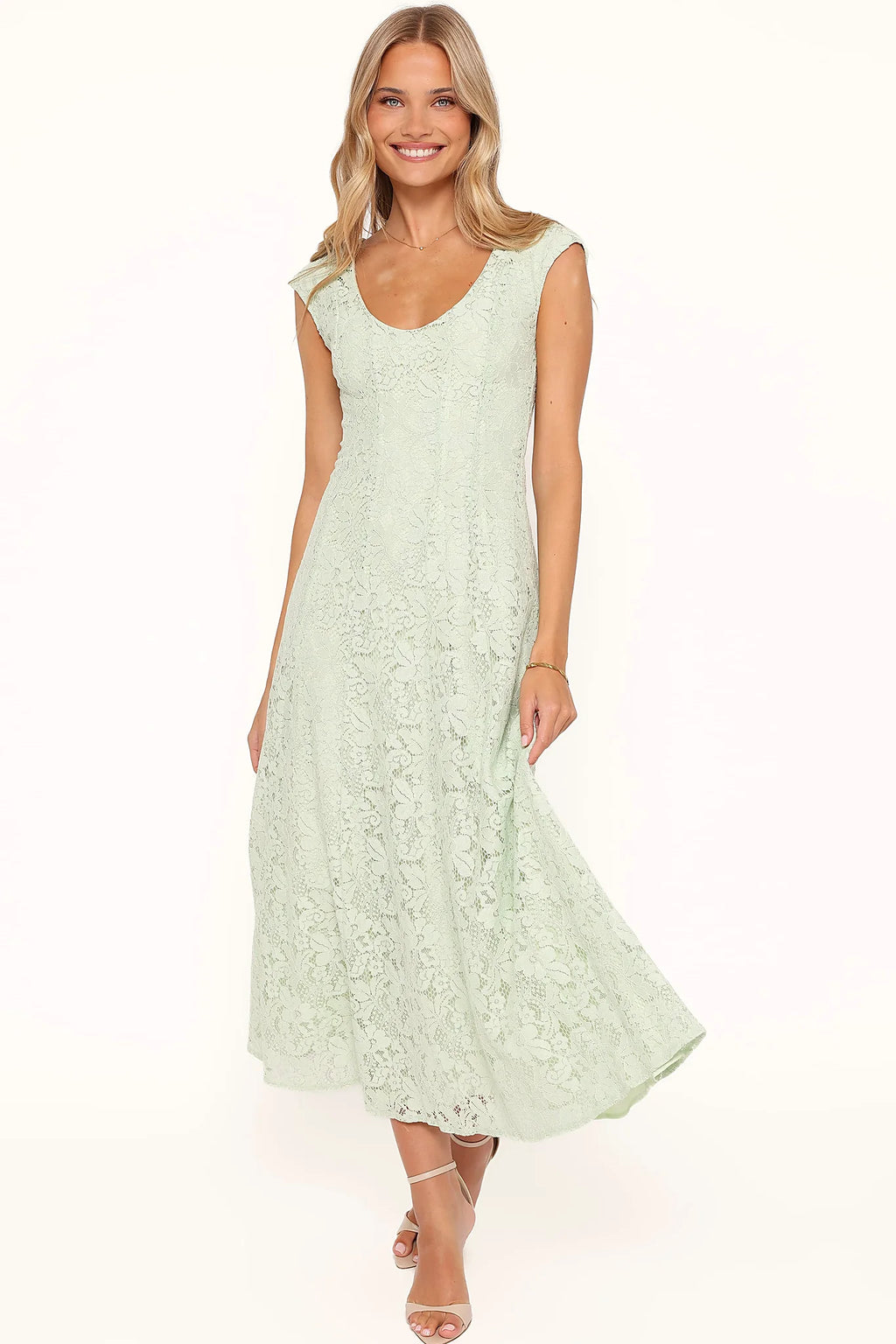 Back view of the sage green lace maxi dress on a model