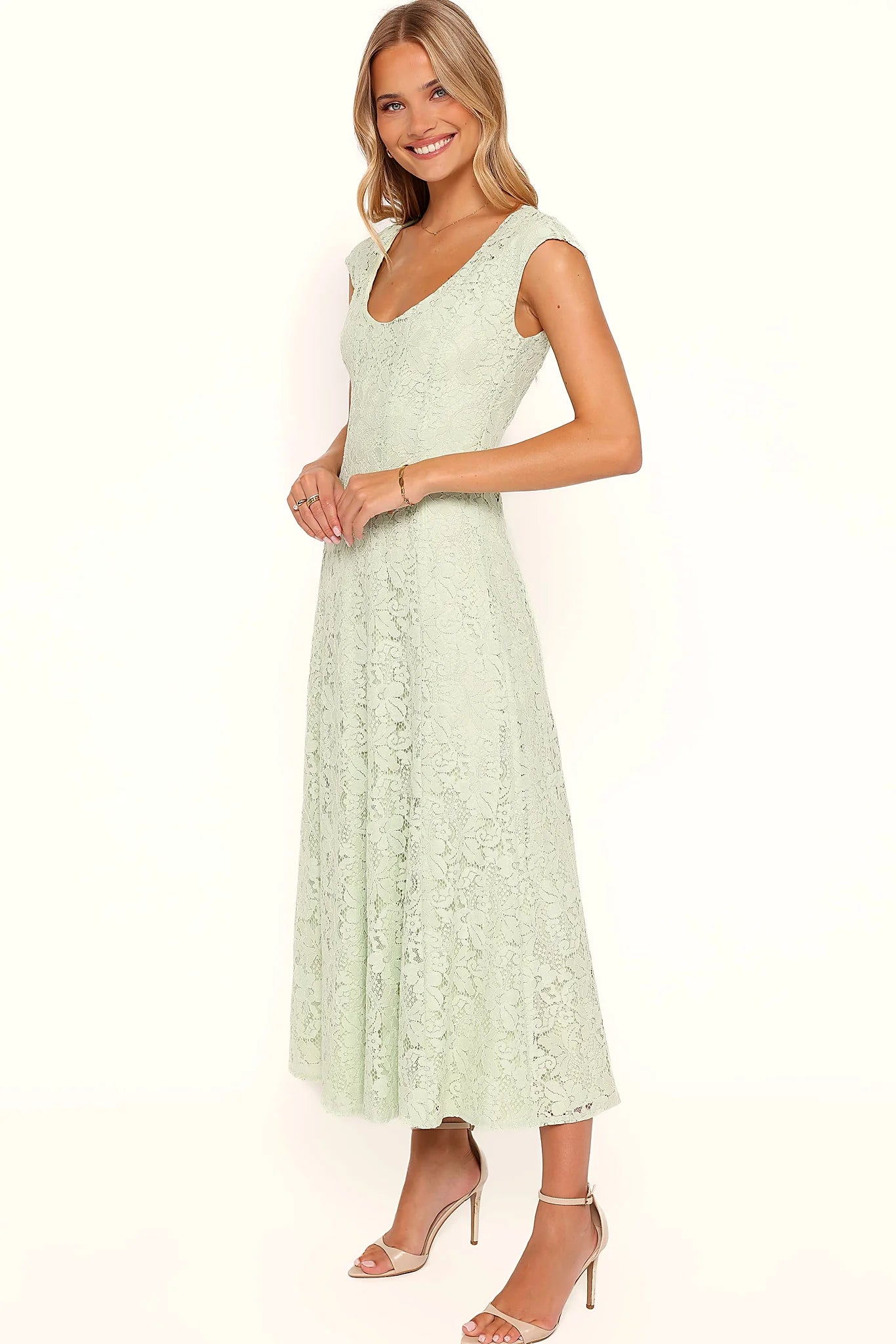 Full-length view of the sage green lace maxi dress