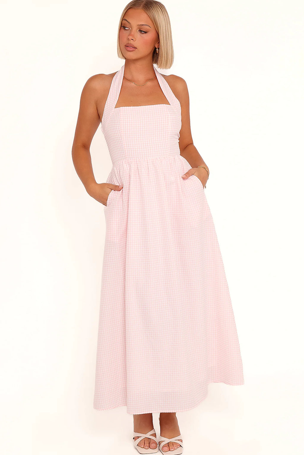 Model wearing the pink gingham halter midi dress, front view