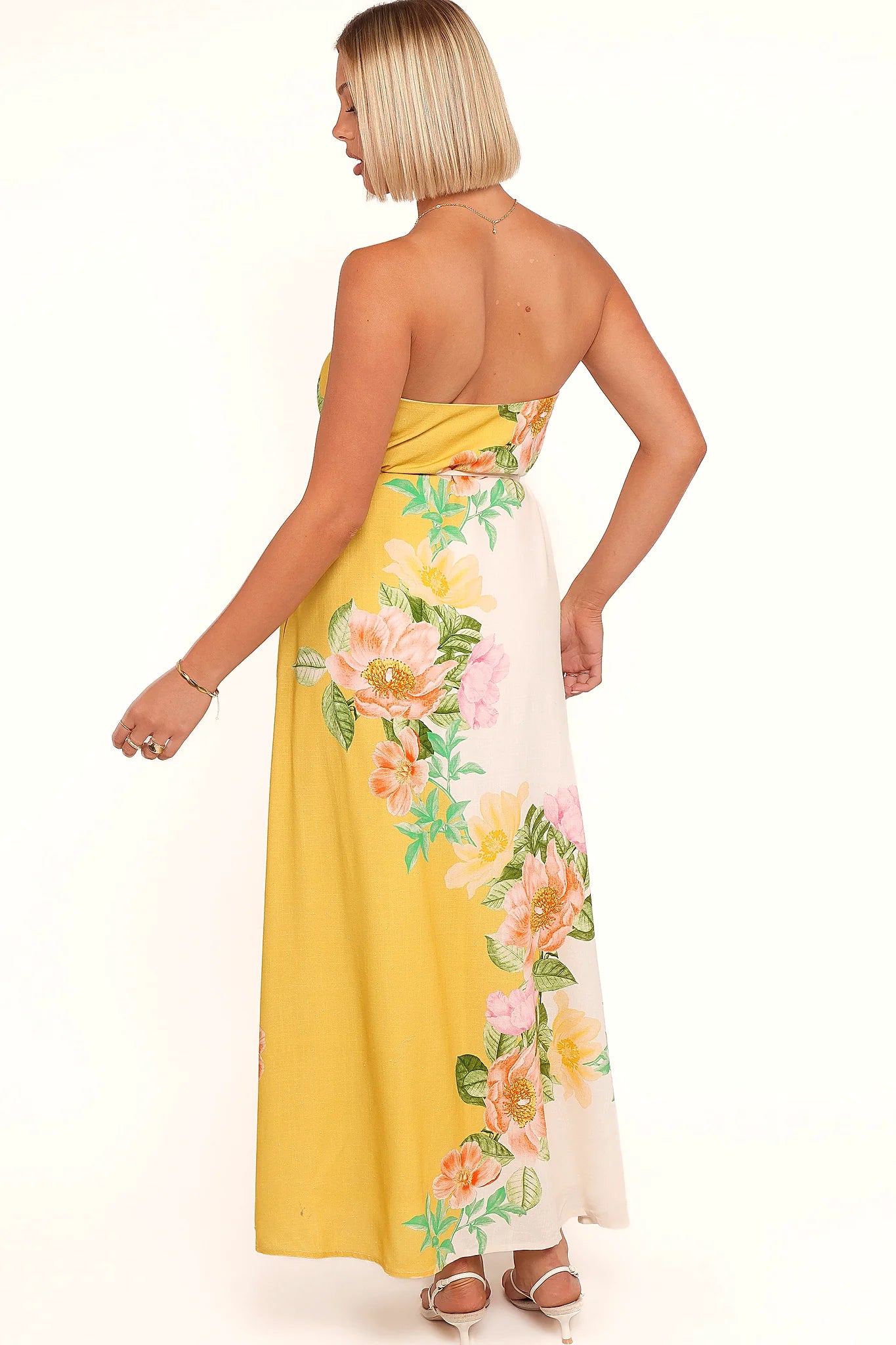 Detail view of the yellow poppy strapless maxi dress