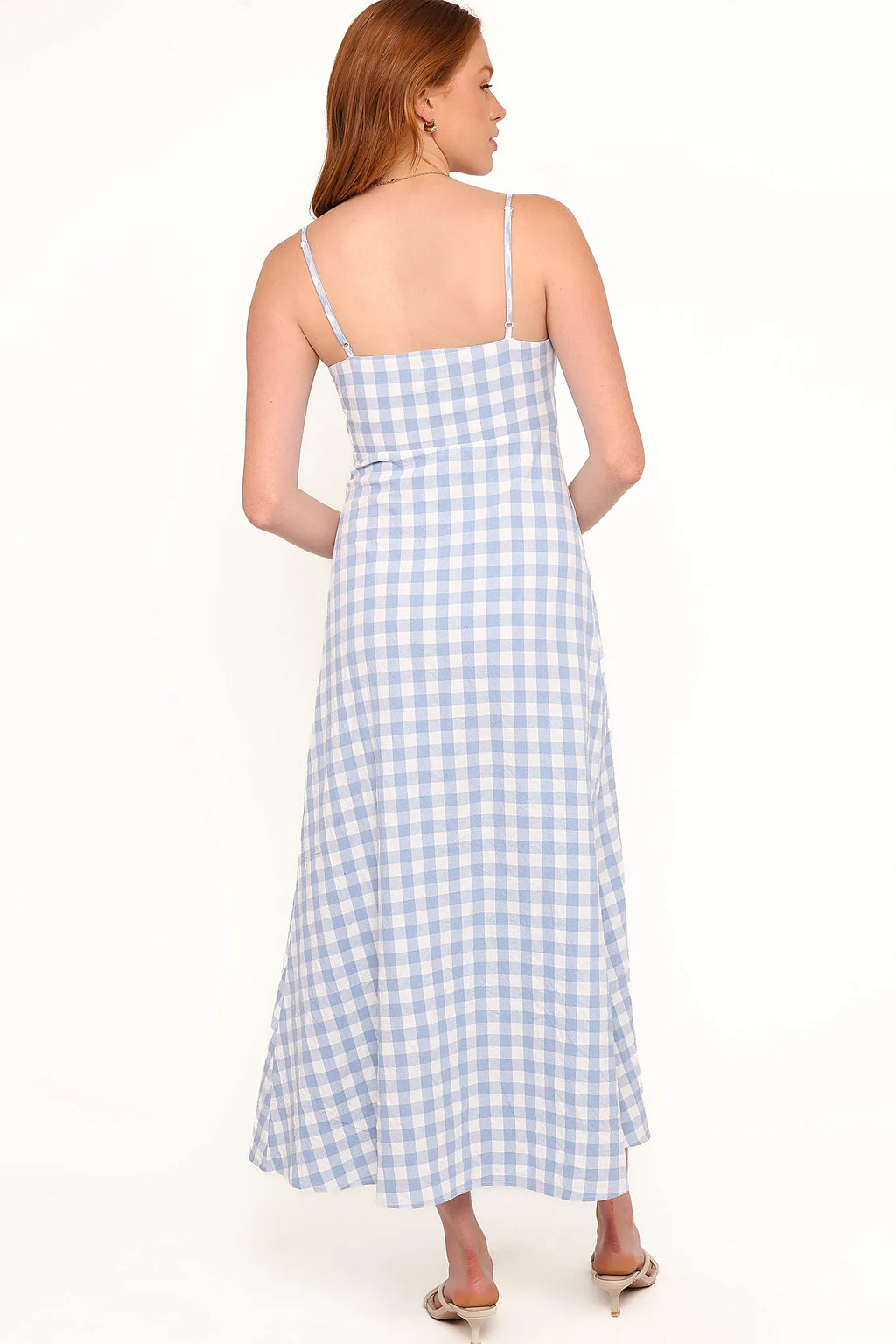 Close-up of the neckline of the blue gingham v-neck maxi dress